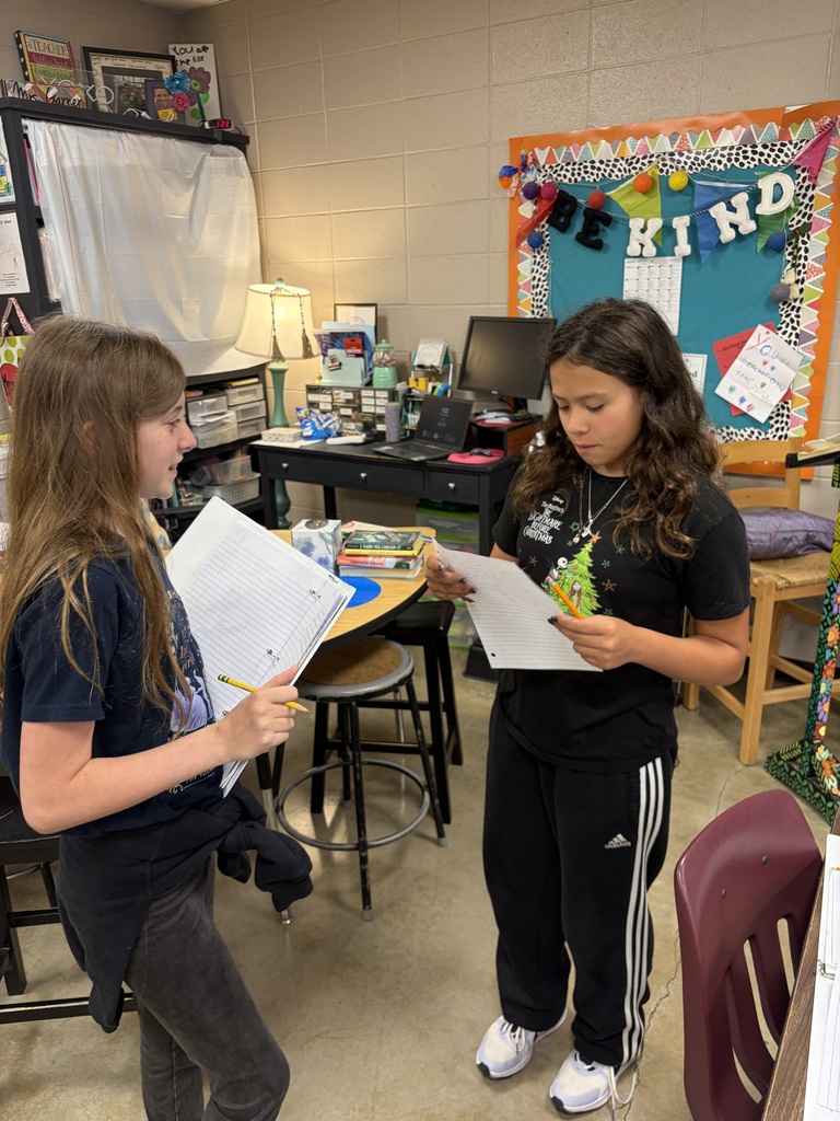 Students working together to critique each others writing