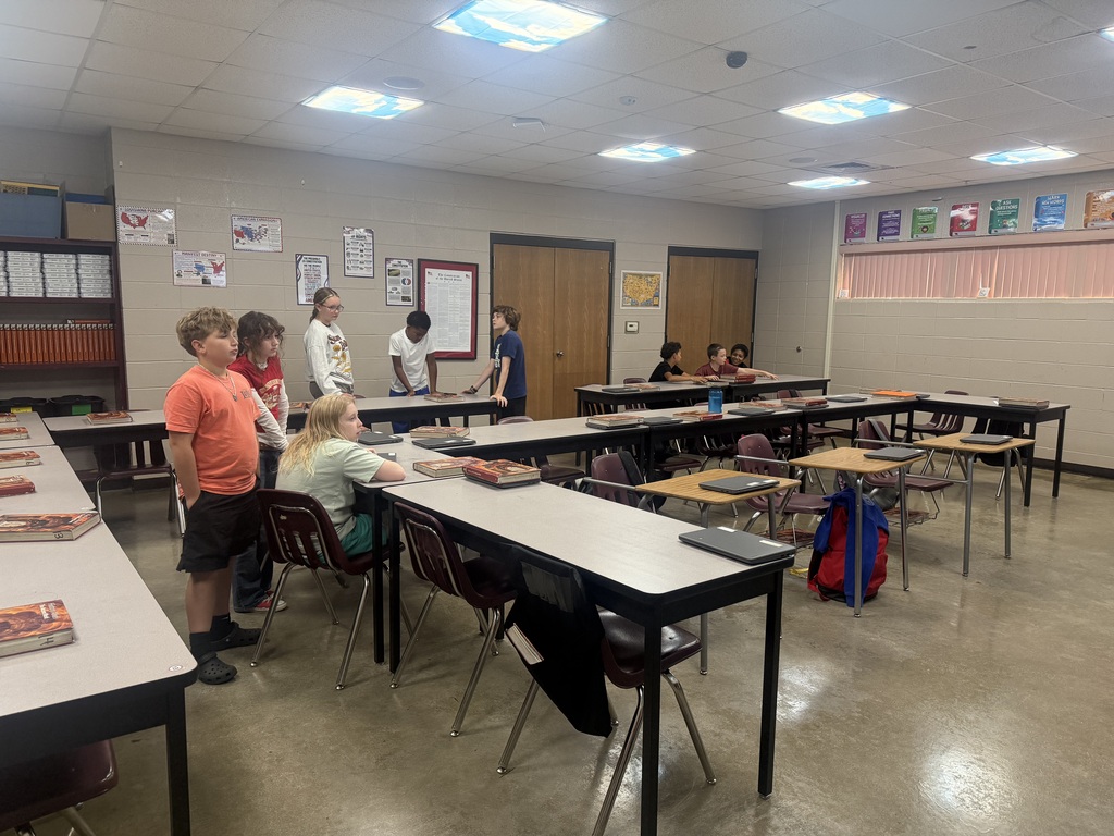 Students looking at something displayed in Mrs. Langley's Class