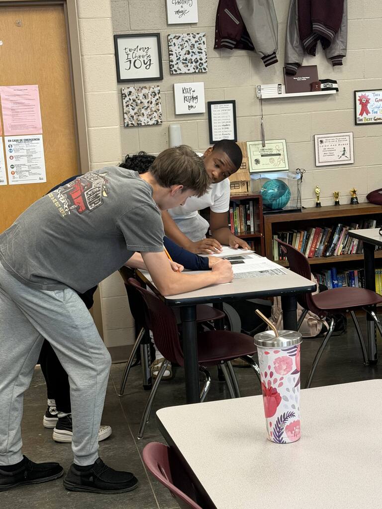 English 9 students completing stations