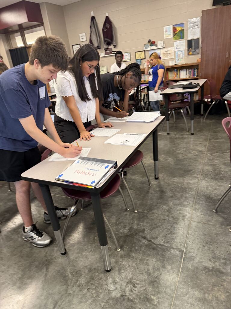 English 9 students completing stations