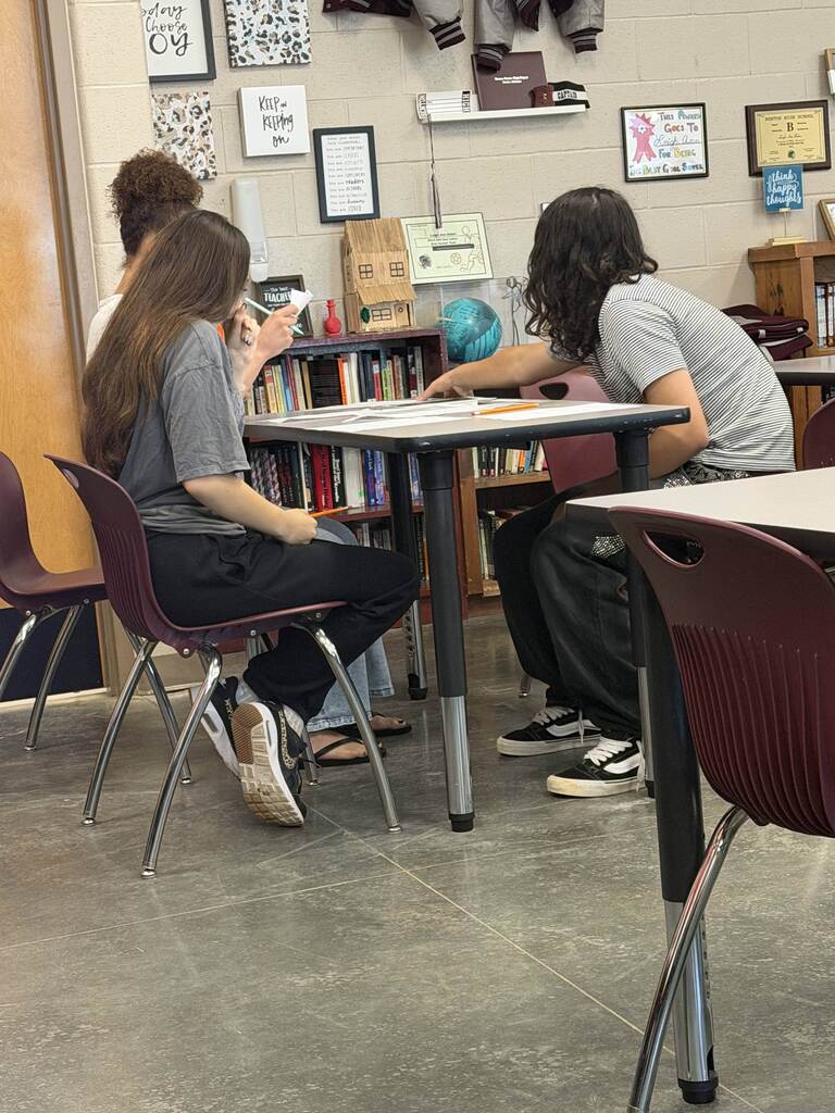 English 9 students completing stations