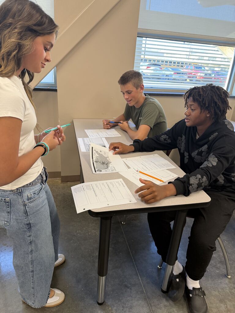 English 9 students completing stations