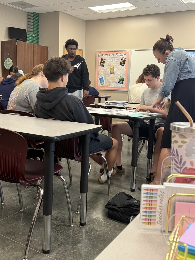 English 9 students completing stations