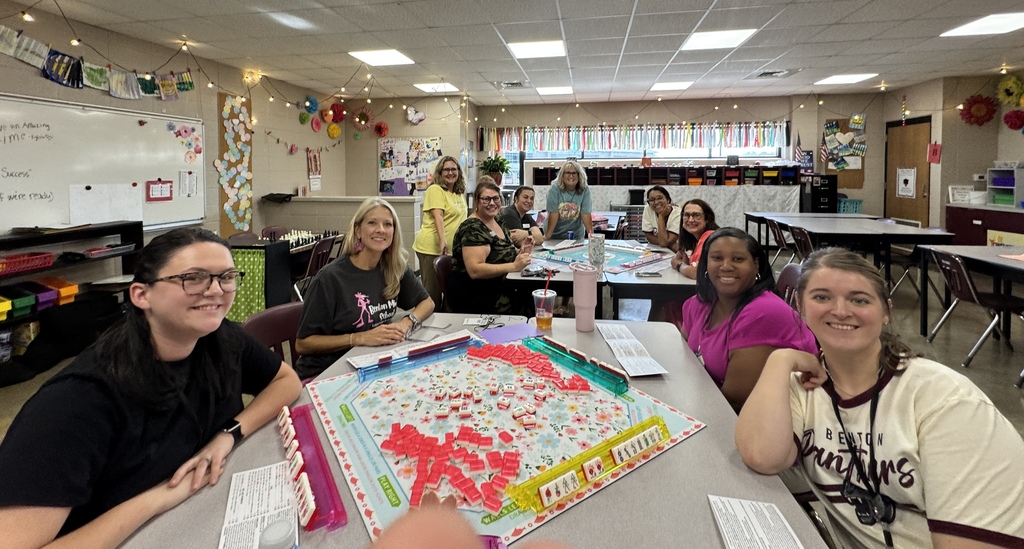 Teachers at BMS smiling for a photo as they partake in the staff Mahjong club meeting