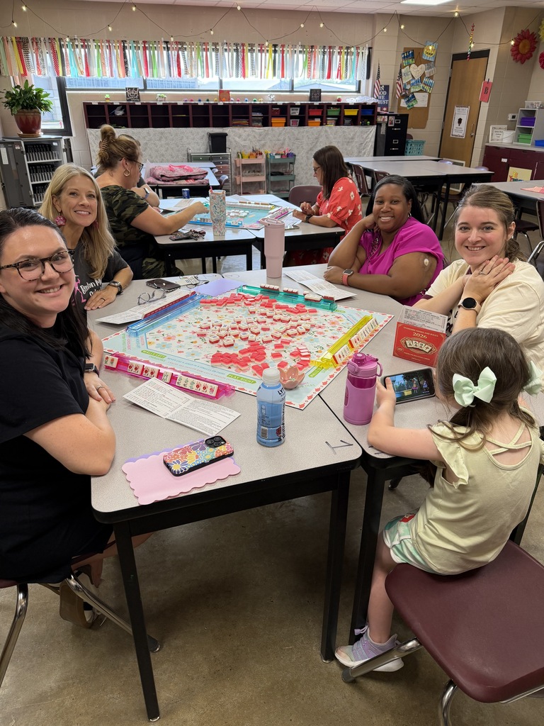 Teachers at BMS smiling for a photo as they partake in the staff Mahjong club meeting