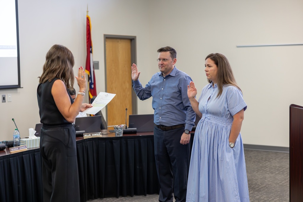 New board members taking the oath of office