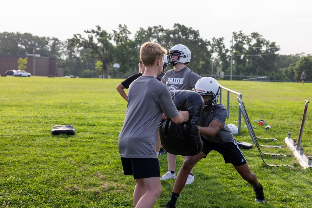 Two football players on the practice field