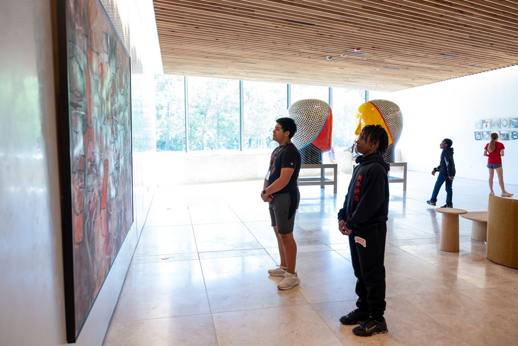 students looking at art