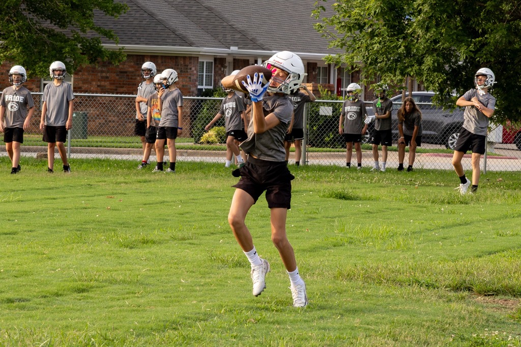 Football player catching a football