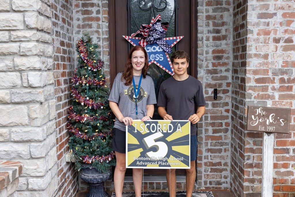 Students Holding Yard Signs