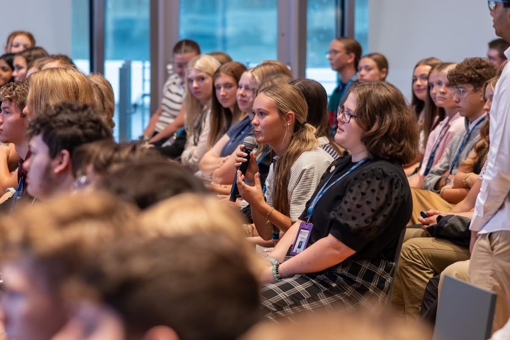 Ignite students listening to a speaker