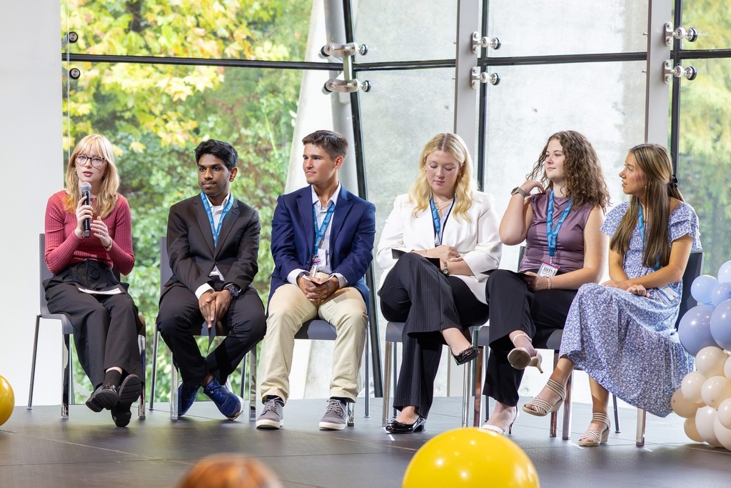 Student panelists speaking from a stage