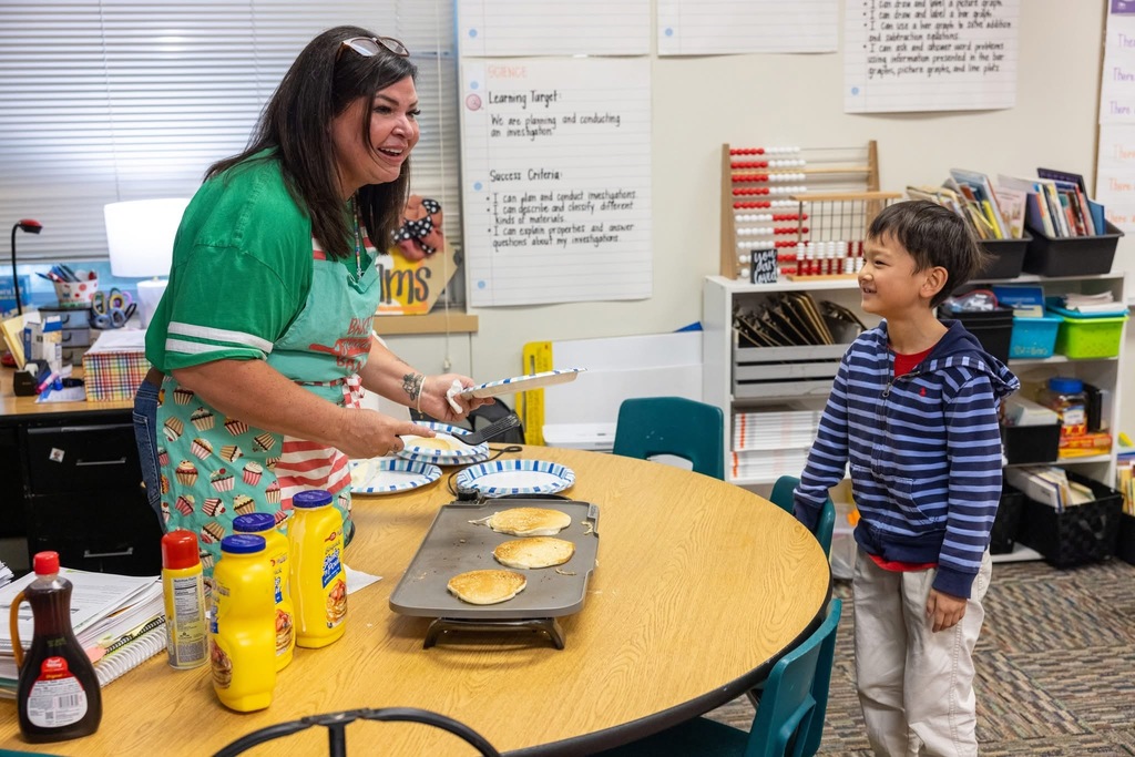 Students eating pancakes 