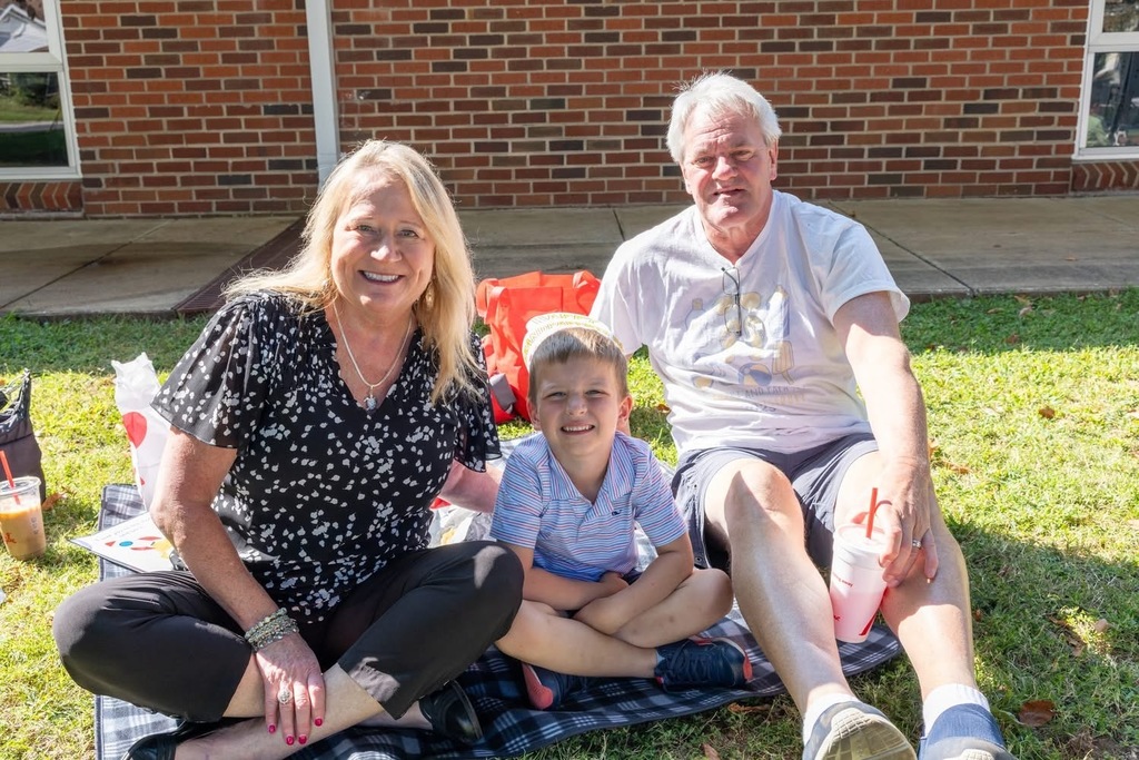 Grandparents with their grands at Excellent Beginnings Childcare Center
