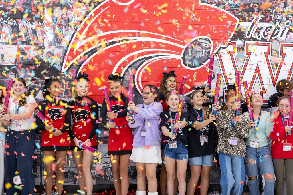 Students setting off confetti cannons