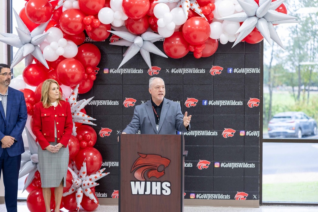 Principal Tim Sparacino speaking from behing a podium