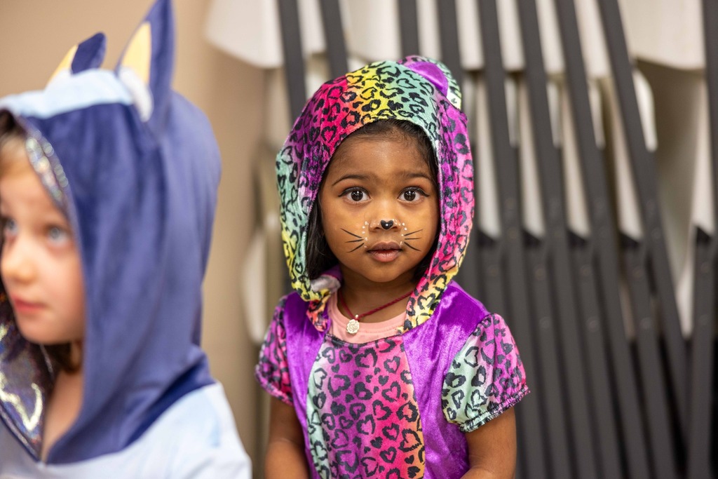 Little girl in a kitten costume
