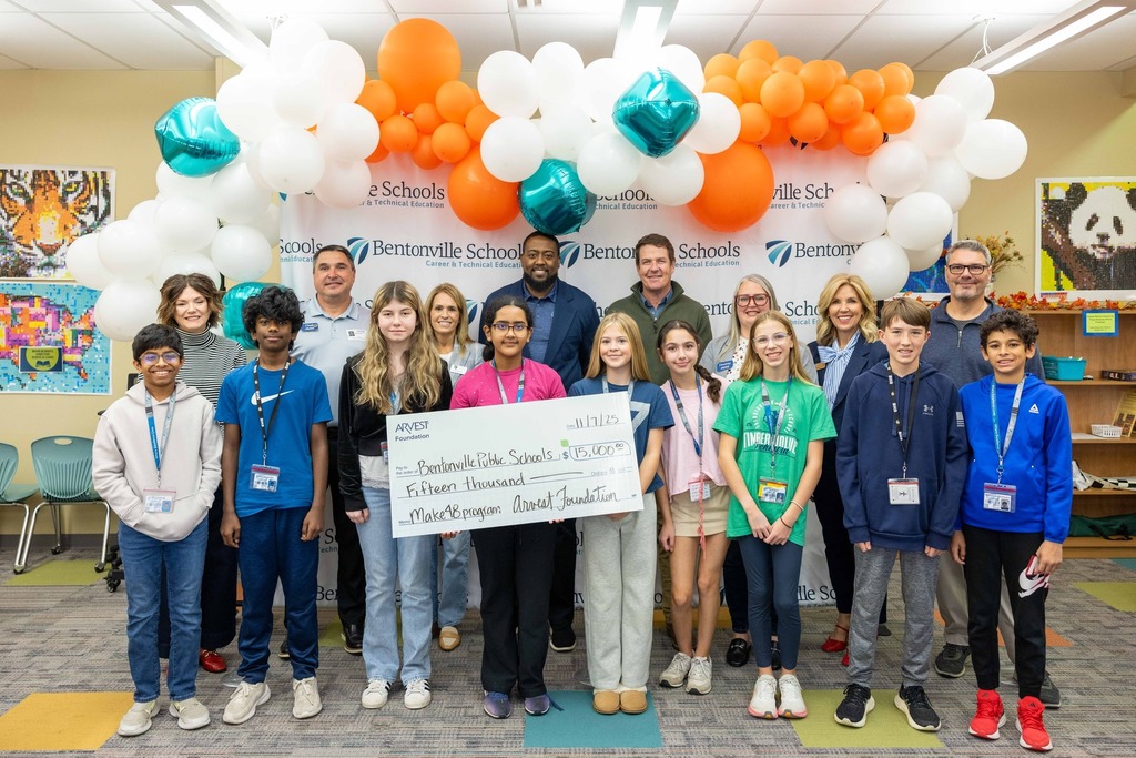 Students holding check for $15,000