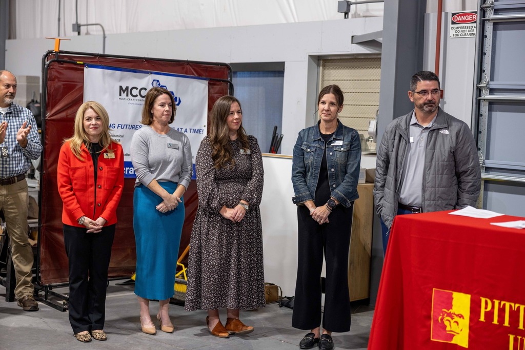 Board of Education members lined up at news conference