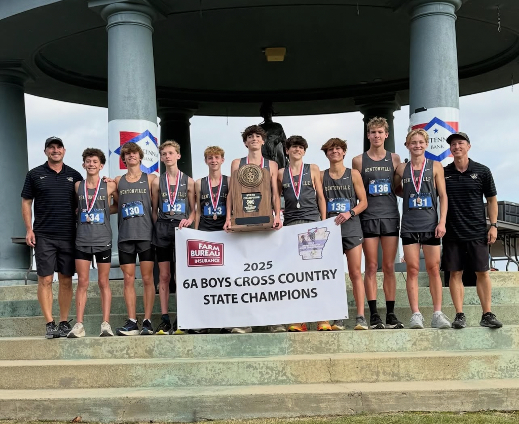 Bentonville High School Men's Cross Country Team Holding the Championship Banner