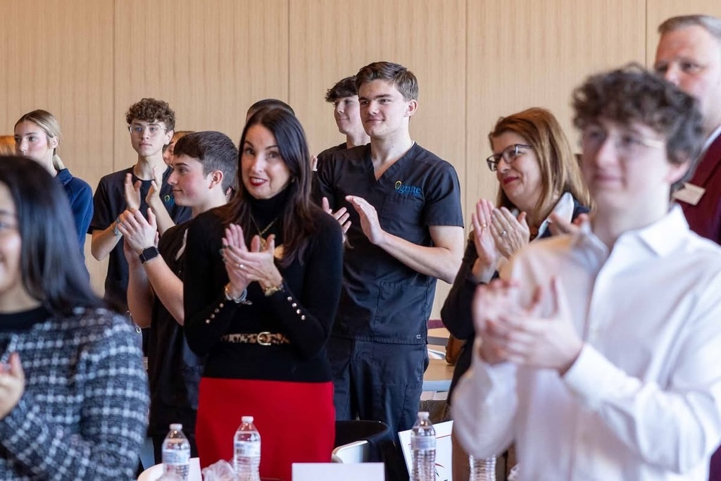 Members of an audience clapping