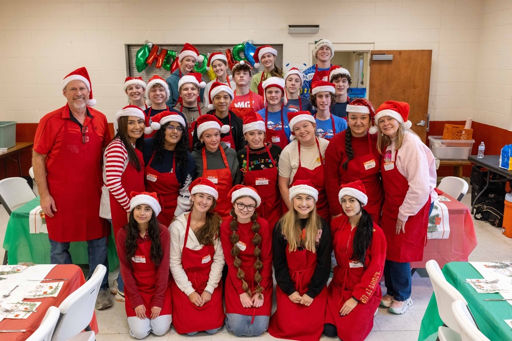 Spanish Club students preparing a meal