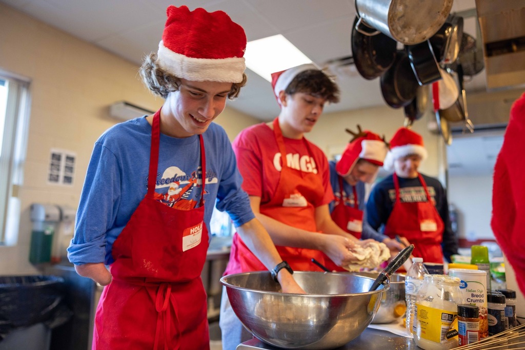 Spanish Club students preparing a meal