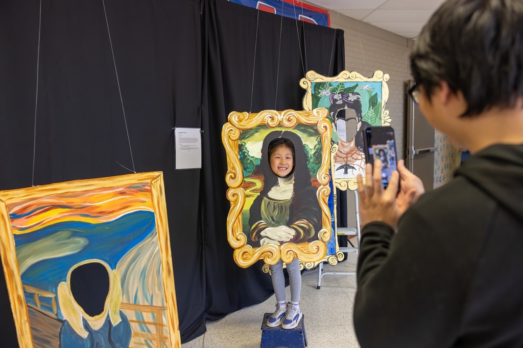 Student Posing with Art