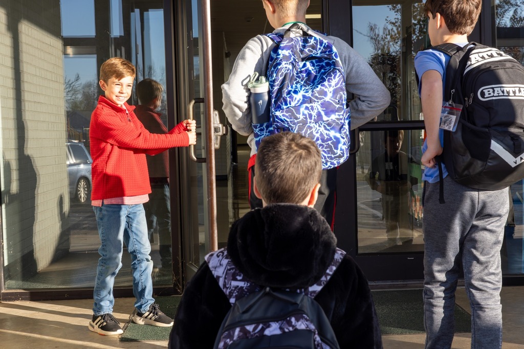 Student Holding the Door Open 