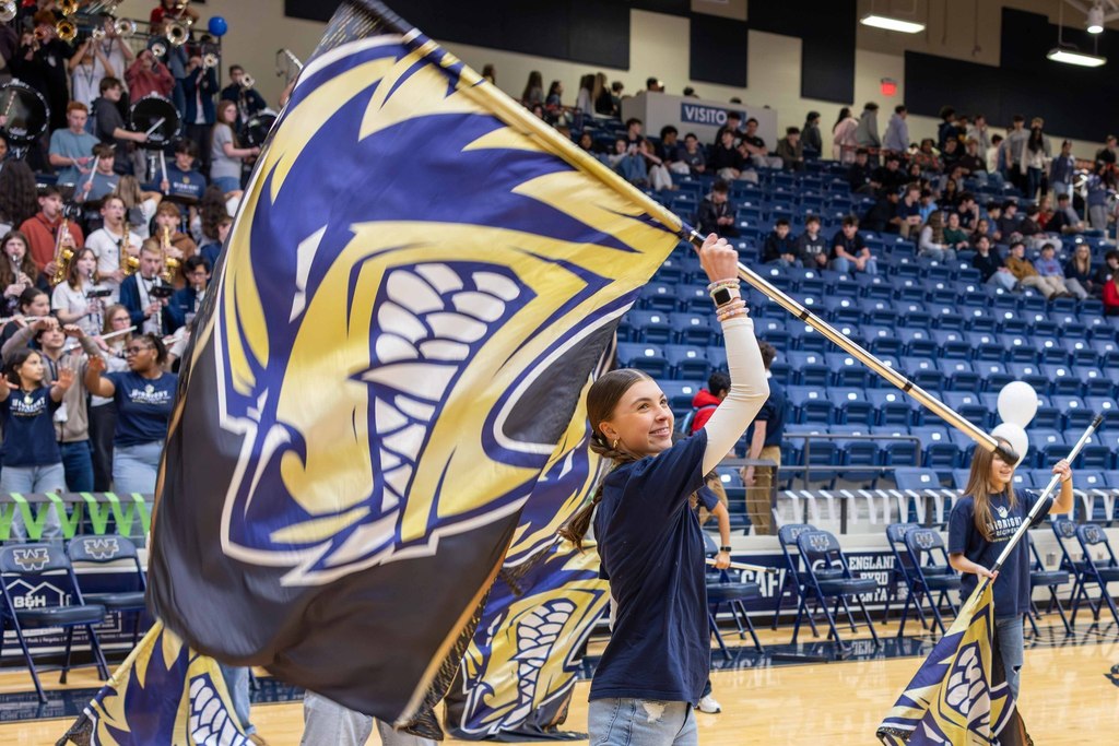 BWHS student waving a spirit flag
