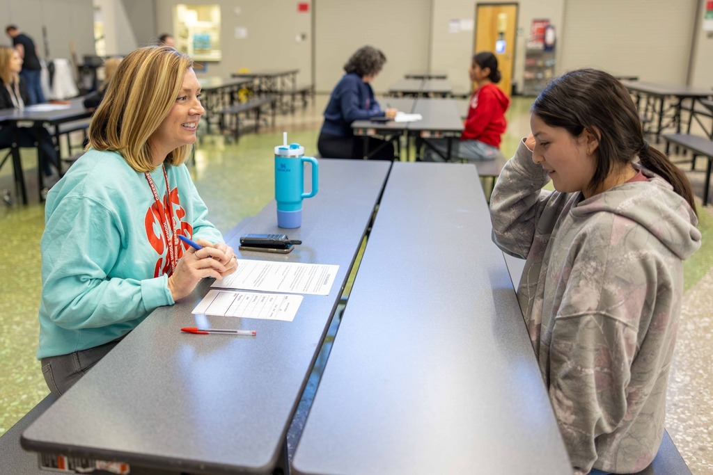Student and her principal participating in mock interview