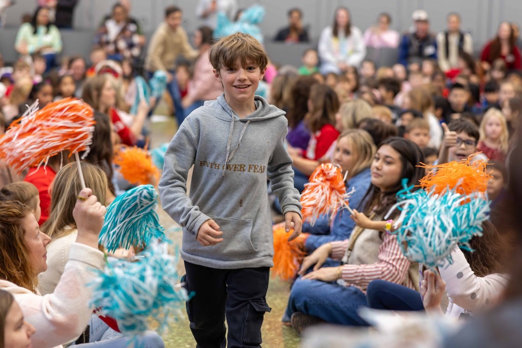 Student Receiving an Award at Osage Creek Elementary