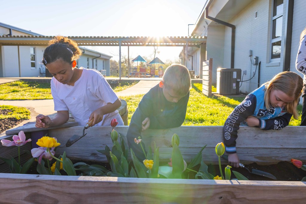Thomas Jefferson Leadership Academy students tend to their tulip garden.