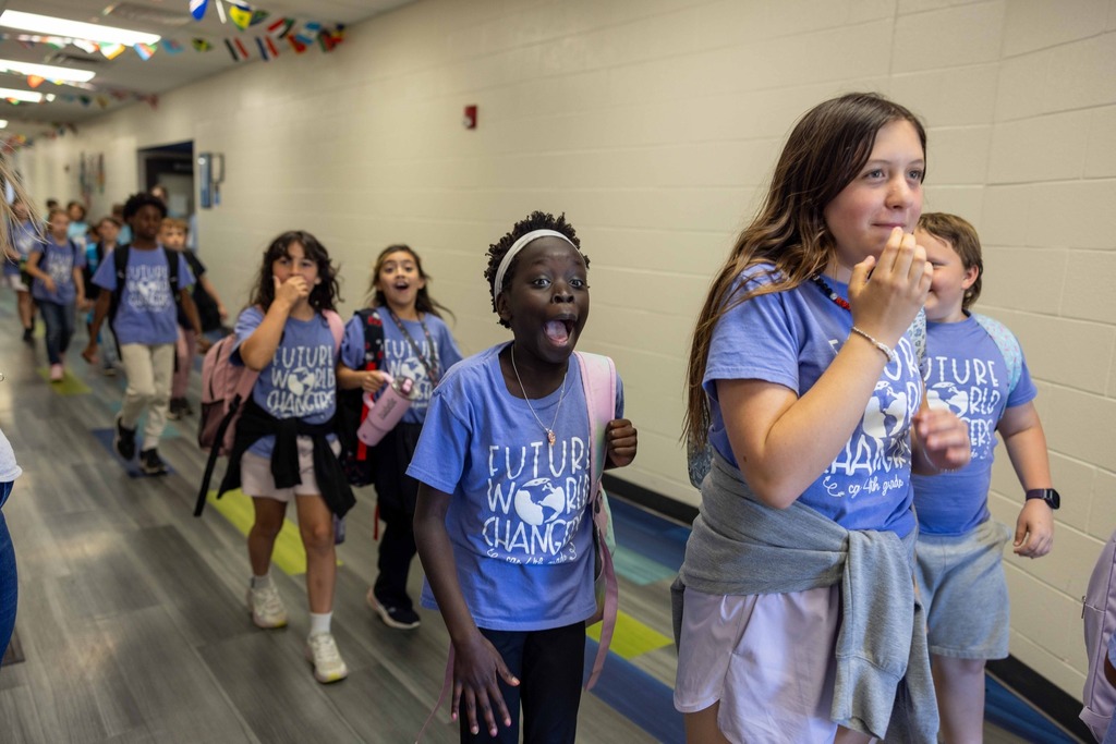 Children with excited faces to see cast of Frozen