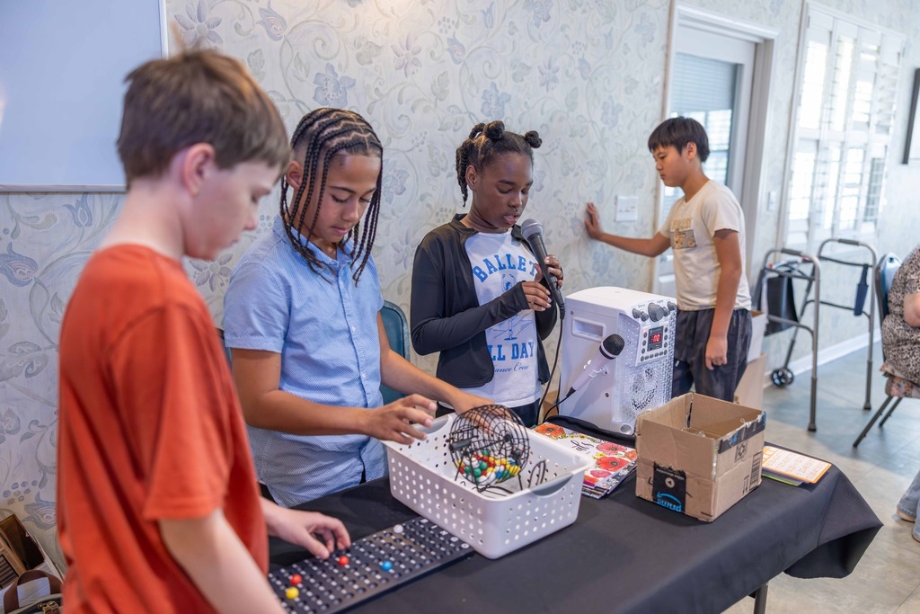 Students caliing numbers in a game of Bingo