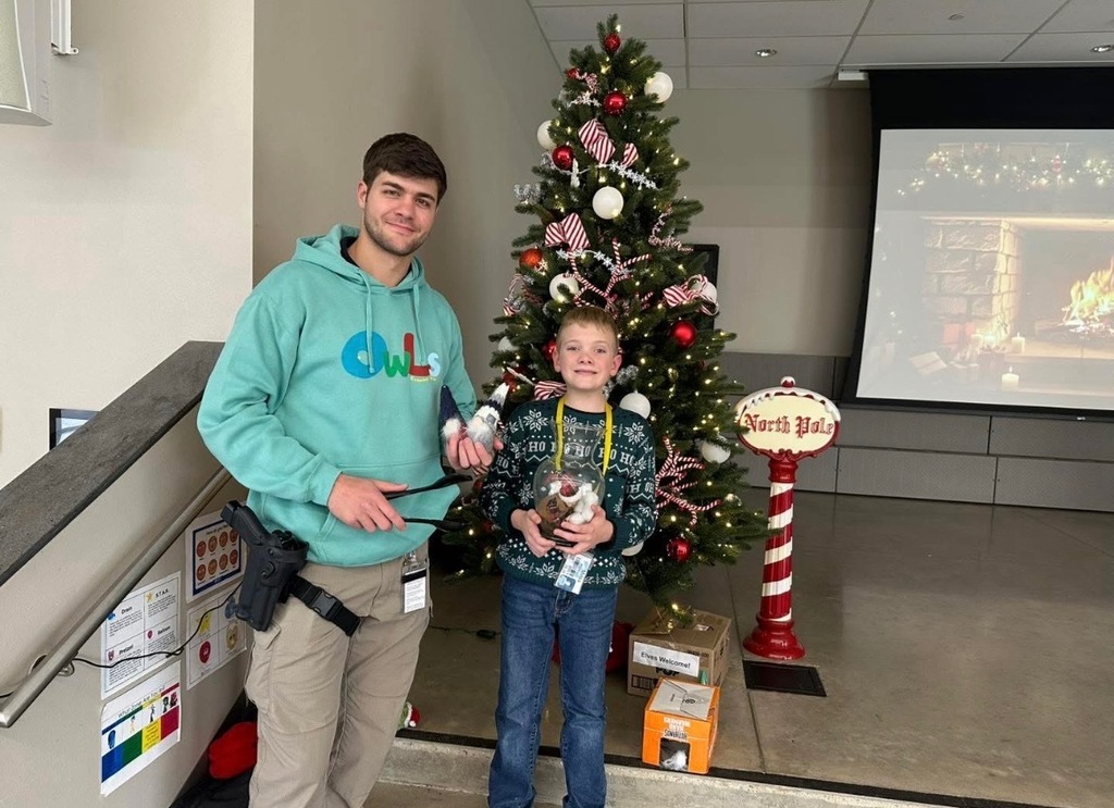 CSSO Ashton Smith & Miles Parton Standing in Front of a Christmas Tree