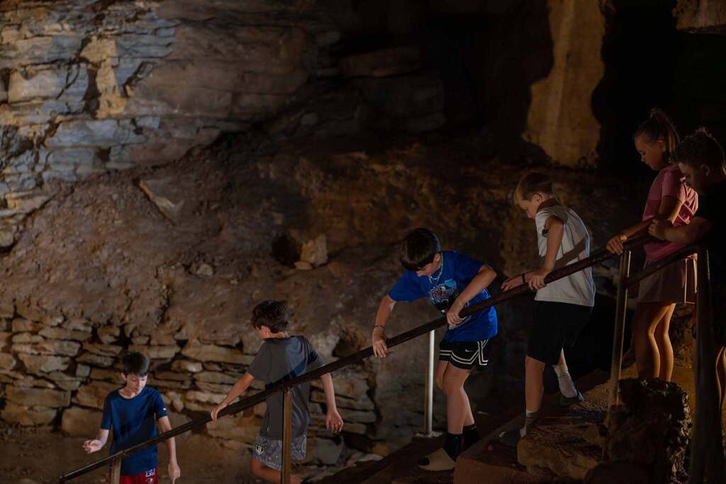 Students descending into a cave