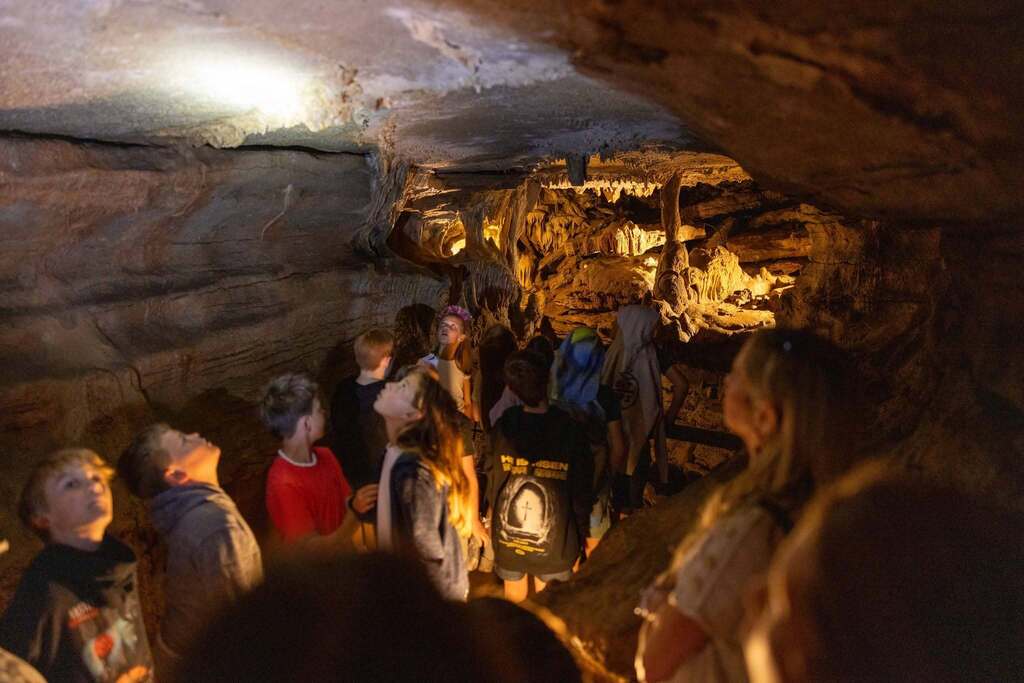 Students exploring a cave