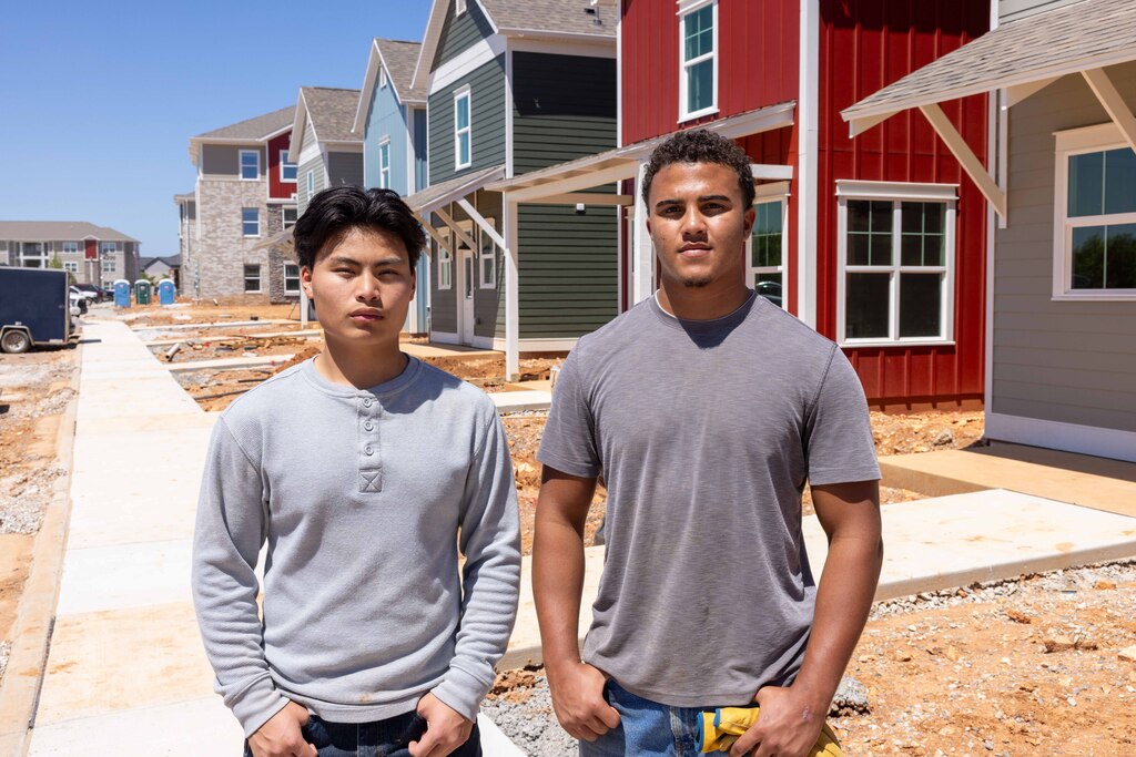Century Vang & Easton Jones standing on a construction job site