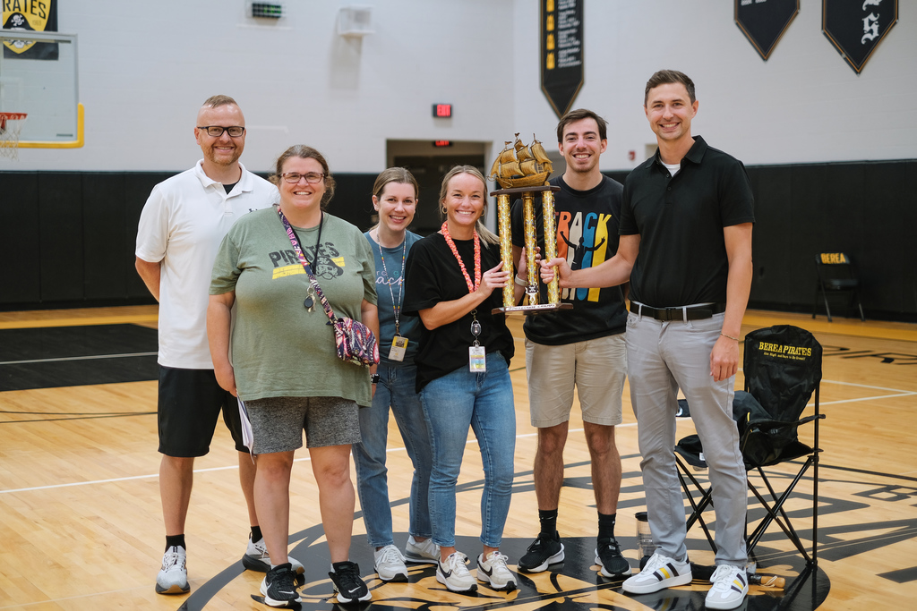 Superintendent poses with trophy winners