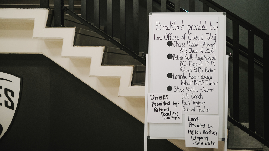 White board displaying the names of those community partners  who helped to serve lunch for our school  staff  at recent events.