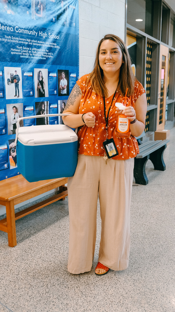 Staff member with a cooler