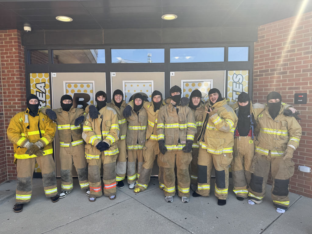 Students dressed in firefighter gear