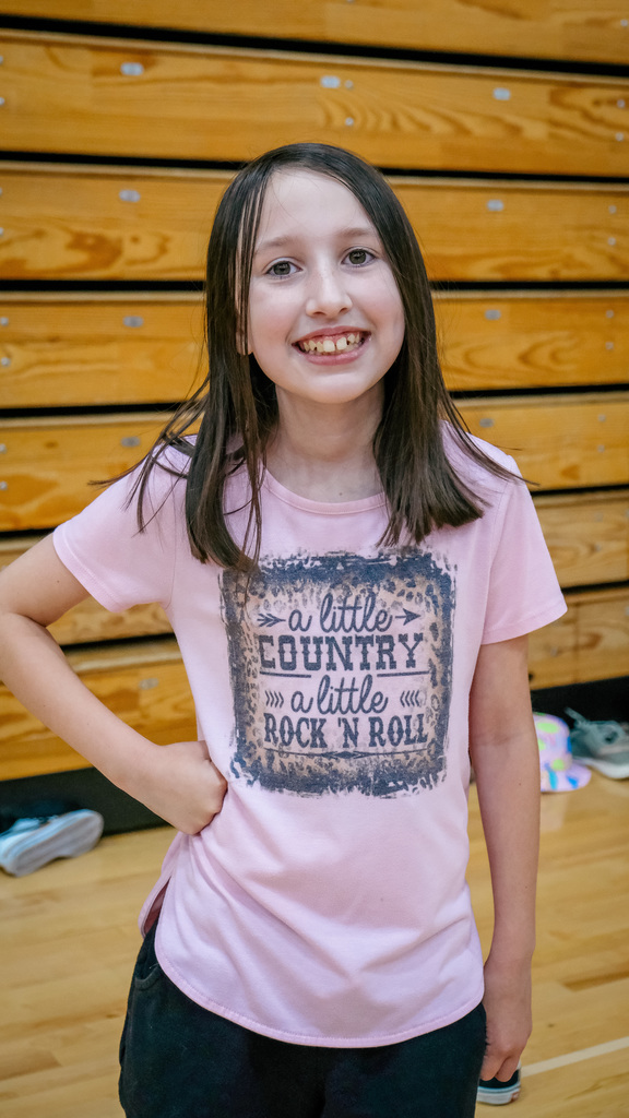 elementary student poses for a photo
