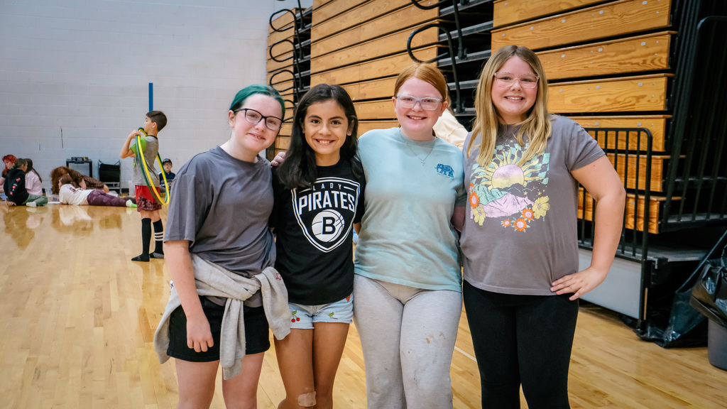 elementary students pose for a photo