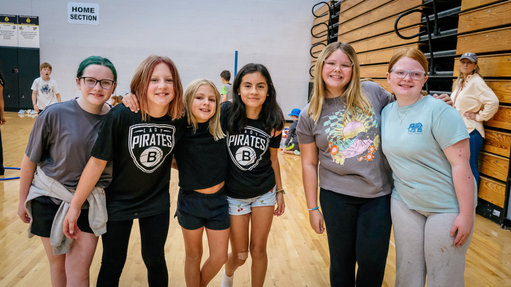elementary students pose for a photo