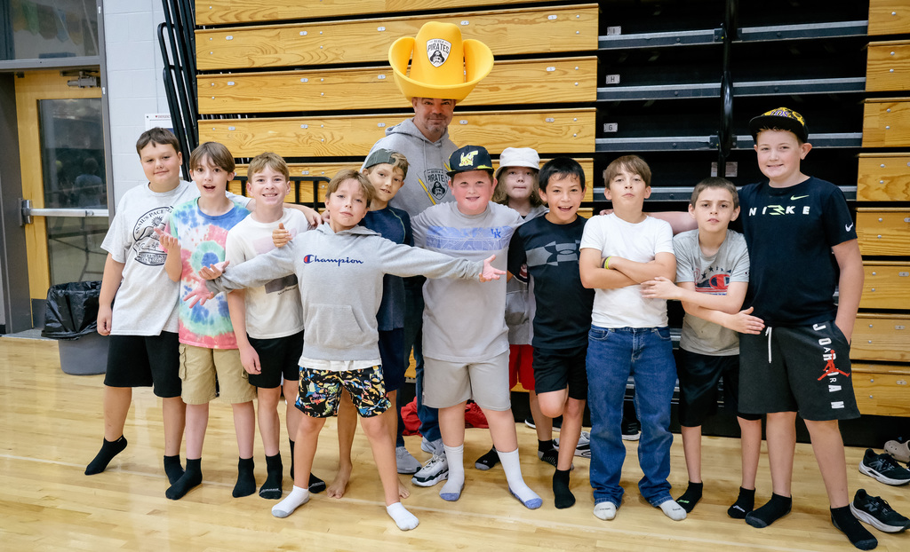 Elementary principal posing with students