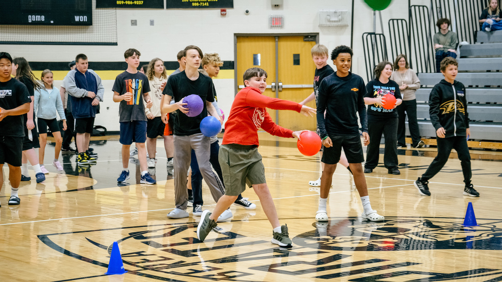 Students throwing dodgeballs