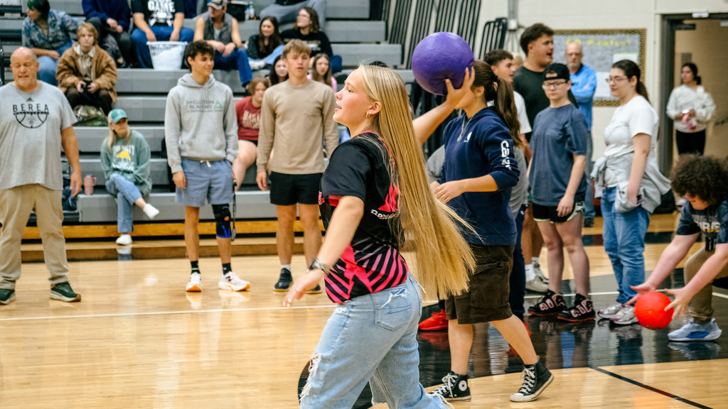 student throwing dodgeball