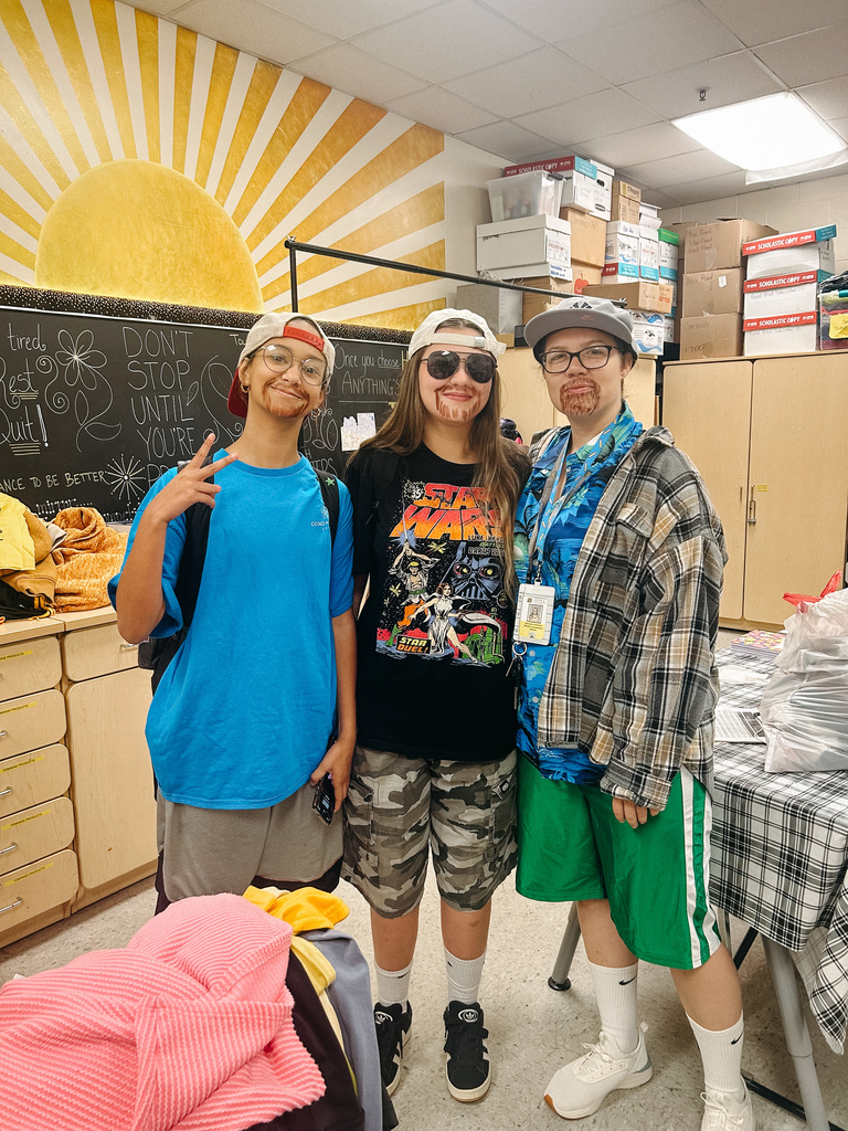 Teacher and students pose for photo dressed as Adam Sandler